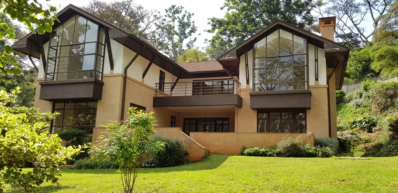 4 units, tucked away behind ingenious trees, sitting on half an acre of mature garden and pristine lawns With a forest scenic front view