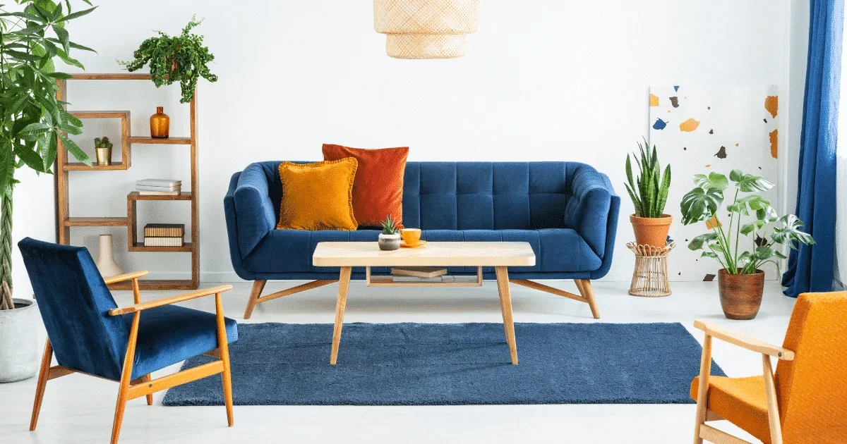 navy blue sofa with colourfull pillows