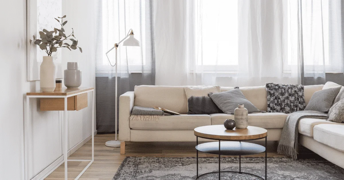 round coffee table with a beige sofa