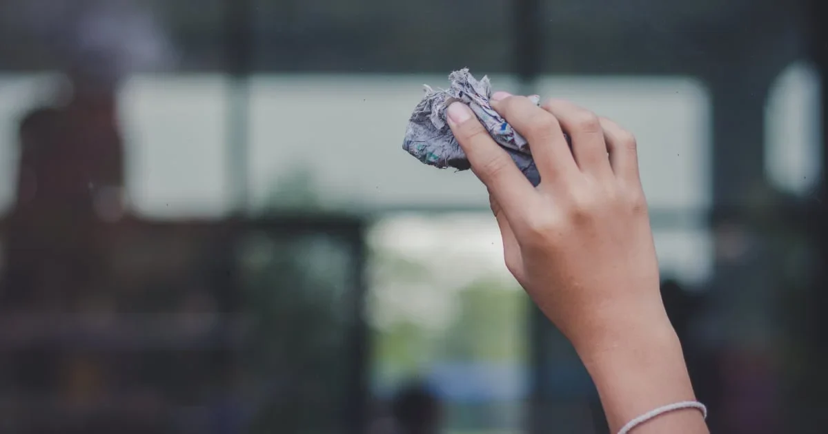 cleaning windows with newspapers